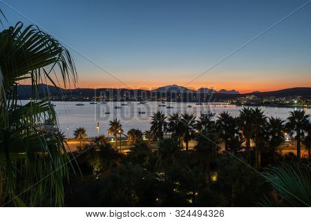 Panoramic View Of The Orange Sunset On The Background Of The Mountains And The Sea Overlooking The P