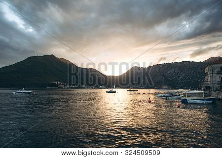 Beautiful View Of The Kotor Bay In Montenegro At Sunset. Natural Mountain Landscape And Sea With Boa
