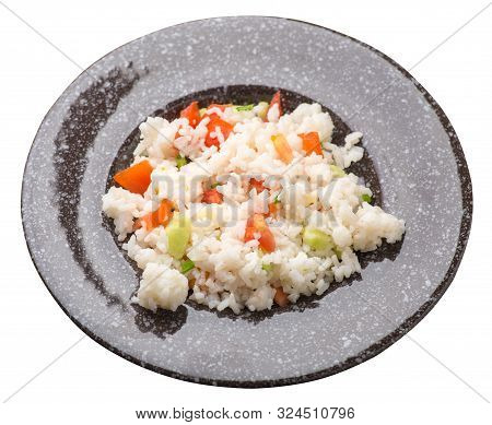 Rice With Vegetables On A Brown With Murble Crumbplate Isolated On White Background . Rice With Toma