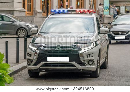 Tbilisi, Georgia - June 28, 2019: Police Car With Included Beacons On An Asphalt Road In The City On