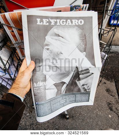 Paris, France - Sep 27, 2019: Man Buys Le Figaro With Jacques Chirac On Cover Of Newspaper Following
