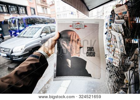 Paris, France - Sep 27, 2019: Man Buying French Liberation With Jacques Chirac On Cover Of Newspaper