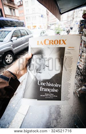 Paris, France - Sep 27, 2019: Man Buying French La Croix With Jacques Chirac On Cover Of Newspaper F
