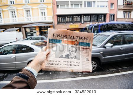 Paris, France - Sep 27, 2019: Man Buys Financial Times With Jacques Chirac On Cover Of Newspaper Fol