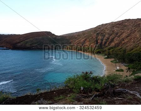 Waves Roll Into Hanamau Bay And Beach On Oahu, Hawaii.