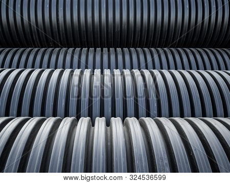 Corrugated Double-walled Pipes. Pipes For Use In Outdoor Sewerage Systems. Big Black Pipes