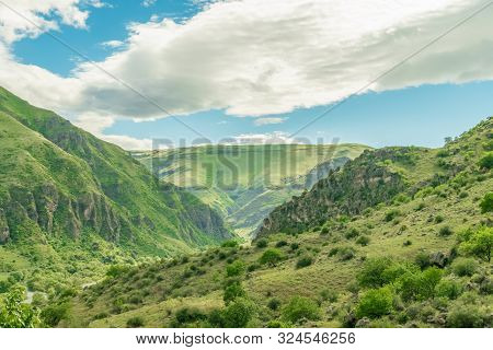 Panoramic View Of Vardzia Cave Monastery Town. View From The Monastery To The River Valley And Green