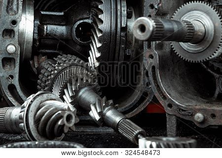 Dismantled Car Gearbox With Gears, Close-up. Repair Box Predach, Repair Of Used Cars. Metal Backgrou