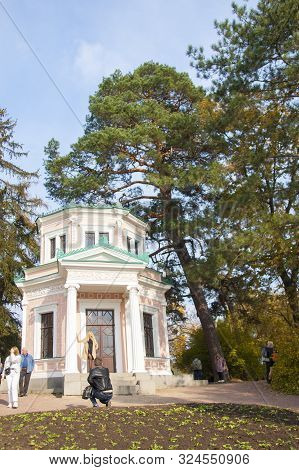 Uman, Ukraine - October 21, 2018: Autumn Landscape Park Sofiyivka. Pink Pavilion On The Island Of An