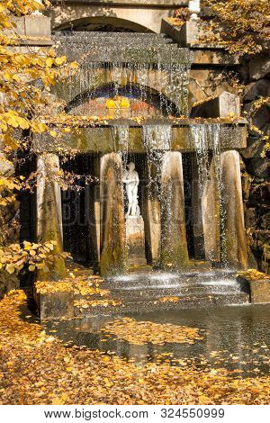 Uman, Ukraine - October 21, 2018: Autumn Landscape Park Sofiyivka. Waterfall And Grotto Tethys