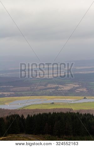 Solar Panels In The Vale Of Neath, From Hirwuan Common.  South Wales, United Kingdom, Portrait