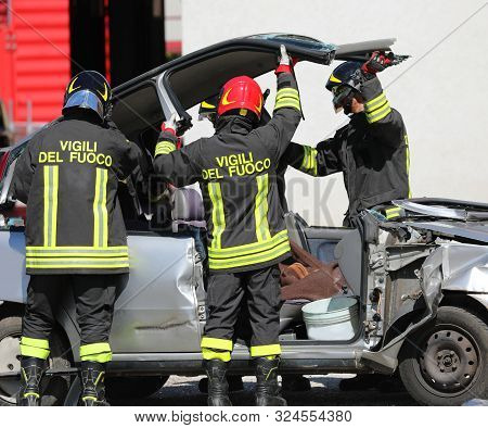 Rome, Rm, Italy - May 16, 2019: Italian Firemen Raise The Roof Of The Car To Extract The Wounded Aft