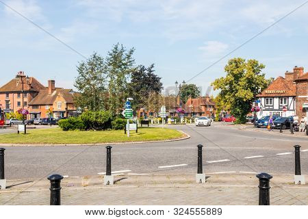 Beaconsfield, England - August 24th 2019: A Car Approaches The Roundabount In Old Beaconsfield. The 