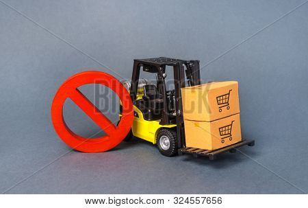 Yellow Forklift Truck Carries Boxex And A Red Prohibition Symbol No. Embargo Trade Wars. Restriction