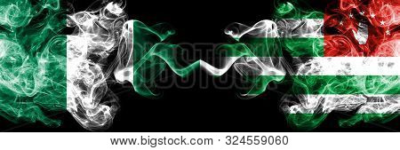 Nigeria Vs Abkhazia, Abkhazian Abstract Smoky Mystic Flags Placed Side By Side. Thick Colored Silky 