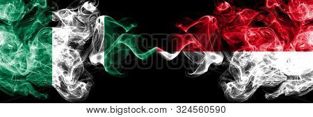 Nigeria Vs Monaco, Monacan Abstract Smoky Mystic Flags Placed Side By Side. Thick Colored Silky Smok