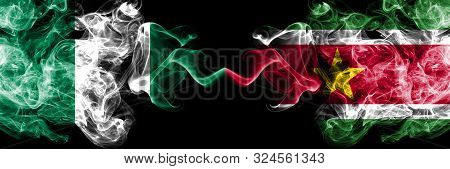 Nigeria Vs Suriname, Surinamese Abstract Smoky Mystic Flags Placed Side By Side. Thick Colored Silky
