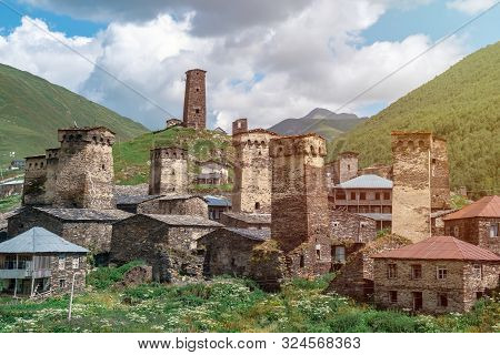 View Of The Ushguli Village At The Foot Of Mt. Shkhara. Picturesque And Gorgeous Scene. Rock Towers
