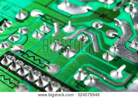 Macro Shot Of A Circuitboard With Resistors Microchips And Electronic Components. Computer Hardware