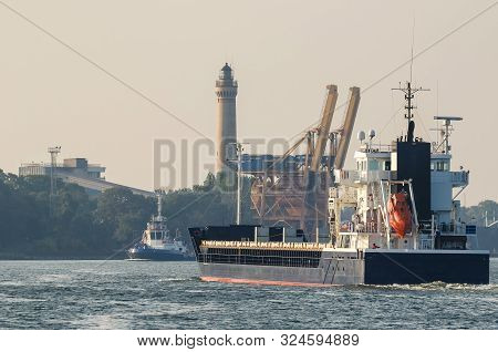 General Cargo Ship - Freighter Is Sailing To The Port