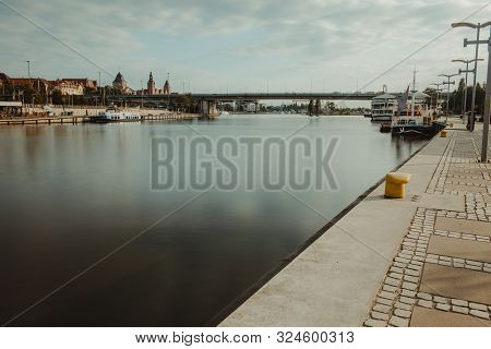 Left Bank Of The Oder River In Szczecin With The Maritime Museum And The Terraces With A Part Of Gro