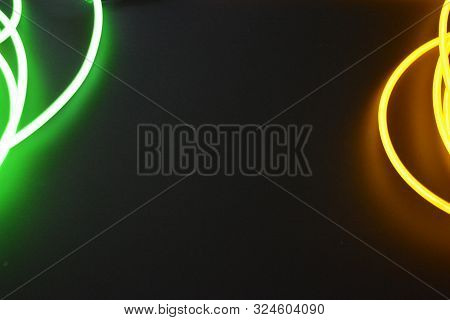 Bright Luminous Yellow And Green, Lime Neon Wires In Different Formats And Layouts. An Electrolumine