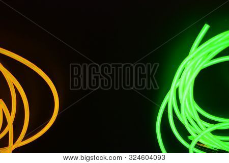 Bright Luminous Yellow And Green, Lime Neon Wires In Different Formats And Layouts. An Electrolumine
