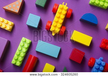 Colorful Kids Toys Frame On Wooden Background. Top View. Flat Lay. Copy Space For Text.
