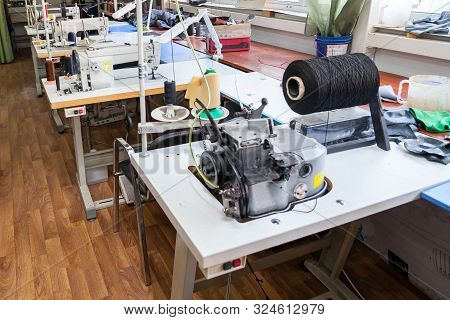 Professional Sewing Machine For Embroidery And Making Clothes In The Workshop.