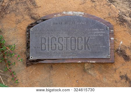 Hluhluwe, South Africa - May 2019: Description Of The Bronze Rhinoceros Statue In The Hluhluwe Natio
