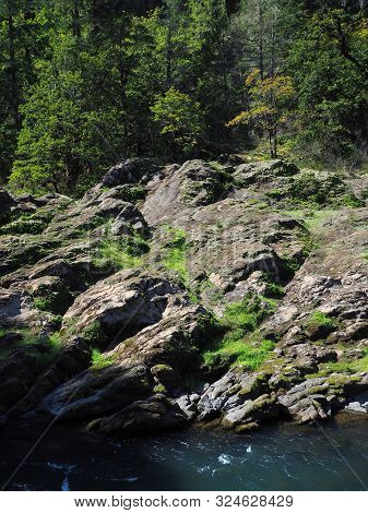 The Rocky And Rugged Shores Of The Middle Fork Of The Willamette River Near Oakridge Oregon Filled W