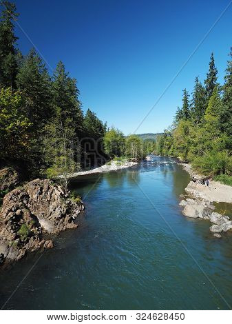 The Rocky And Rugged Shores Of The Middle Fork Of The Willamette River Near Oakridge Oregon Filled W