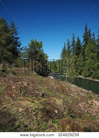 The Rocky And Rugged Shores Of The Middle Fork Of The Willamette River Near Oakridge Oregon Filled W