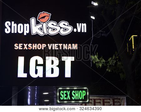 Danang, Vietnam - 26 Jul 2019: Sexshop Banner Lighting In Dark Street. Sex Shop Sign By Night. Moder