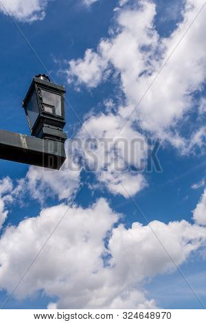 Street Lantern Against Blue Clouded Sky On A Sunny Day