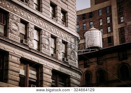 Water Tunk On The New York Building With Ornamental Facade