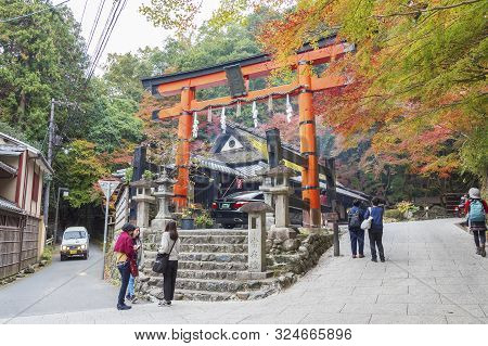 Kyoto, Japan - November 18, 2018 : Tourist Visiting The Historical Landmark Torii Gate In Saga Torii