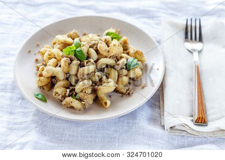 Traditional Soviet Russian Pasta Dish, Vermicelli, Navy Pasta, With Meat On A White Plate On A Light