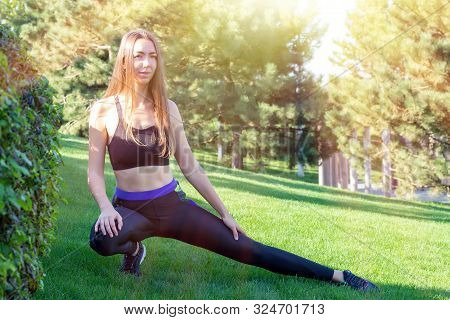 Fitness. Athlete Girl, Thlete Exercise At Outside, Woman Fitness. Young Beautiful Woman Stretching I
