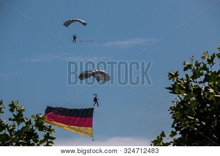 German Skydiver In The Air With German Flag