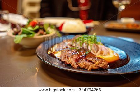 A Wagu Steak Dish With Potato Mash Served In A Japanese Restaurant