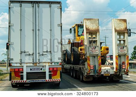 Rockhampton, Queensland, Australia - 16th September 2019: Two Semi Trailers On The Highway Moving Th
