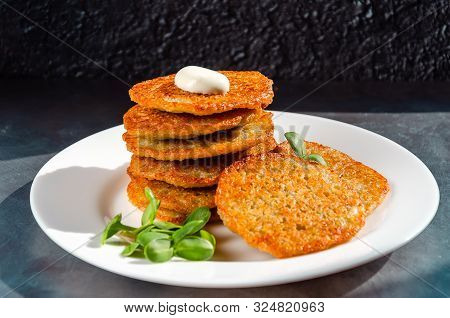 Homemade Potato Pancakes, Latkes, Draniki, Hash Browns Or Fritters Served With Sour Cream And Sunflo