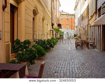 Mantova, Italy - August 10, 2019: Cafe Tables On The Street In Mantova, Italy