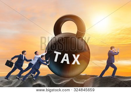 Businessman pulling kettlebell in tax concept