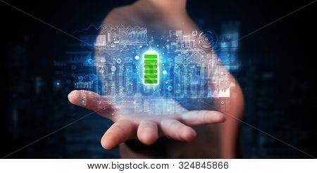Elegant hand holding battery with full of energy