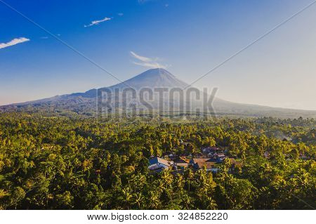 Aerial View Of Tumpak Sewu Waterfall And Semeru Mountain At Sunrise Located In East Java, Lumajang,