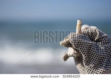 Collection Of Cigarette Butts By Volonteers On A Beach
