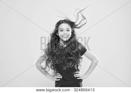 Girl Adorable Kid Long Wavy Hair Yellow Background. Strong Persistent Winds Can Create Tangles And S