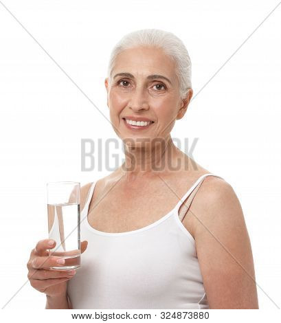 Portrait Of Beautiful Mature Woman With Glass Of Water On White Background